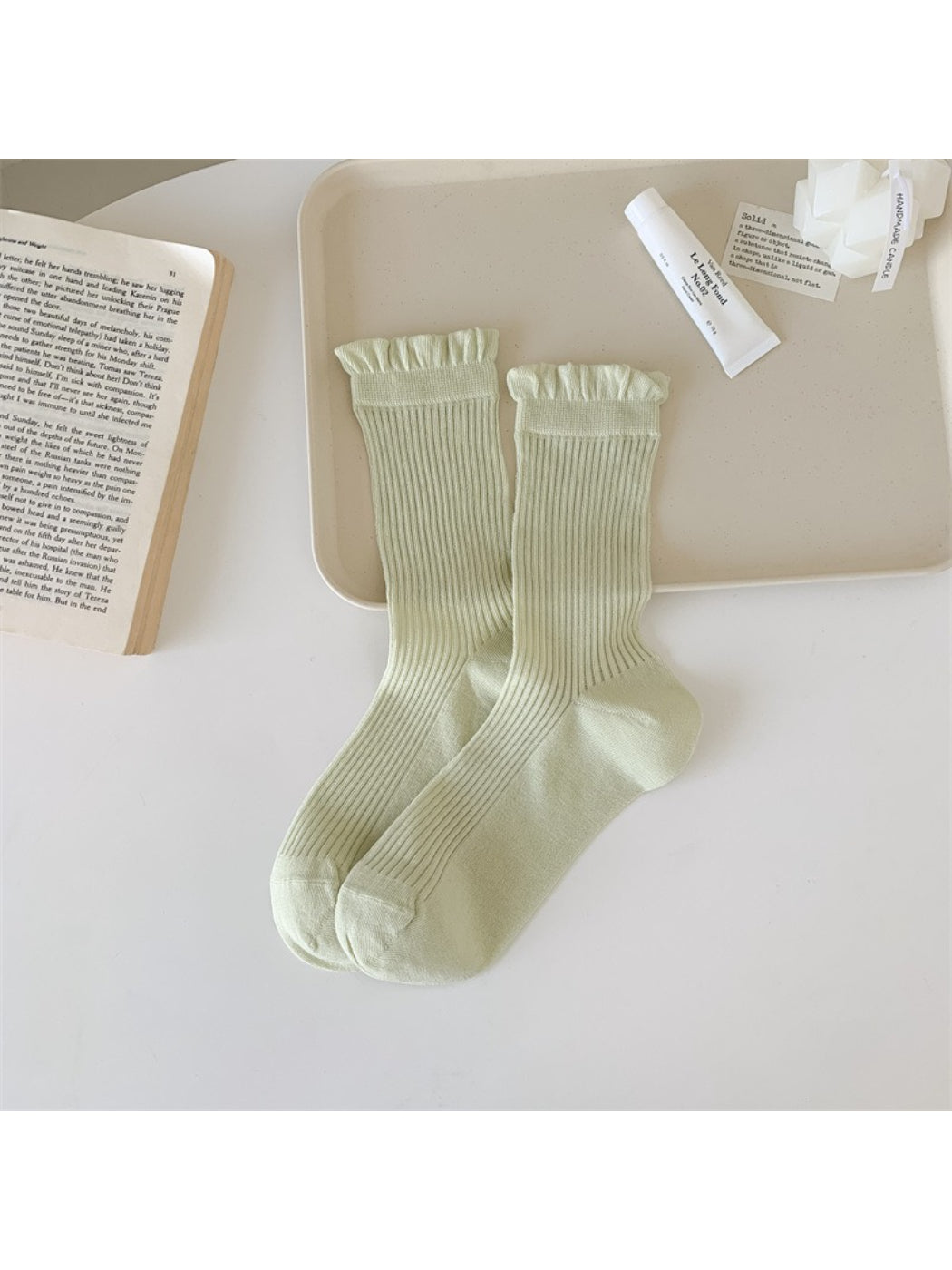 Model wearing Rufia Everyday Ruffle Cuff Crew Socks with a casual outfit outdoors