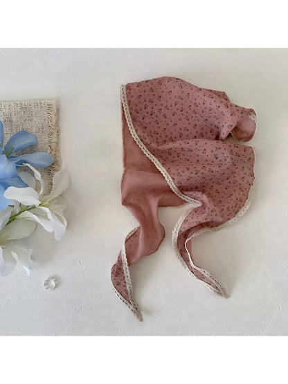 Scarvii ditsy floral lace tie headscarf tied in a bow on a mannequin