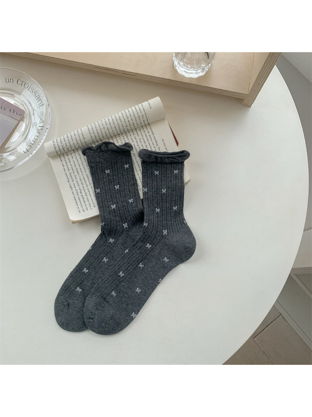 Rufia ribbed crew socks styled with rolled-up pants and sneakers