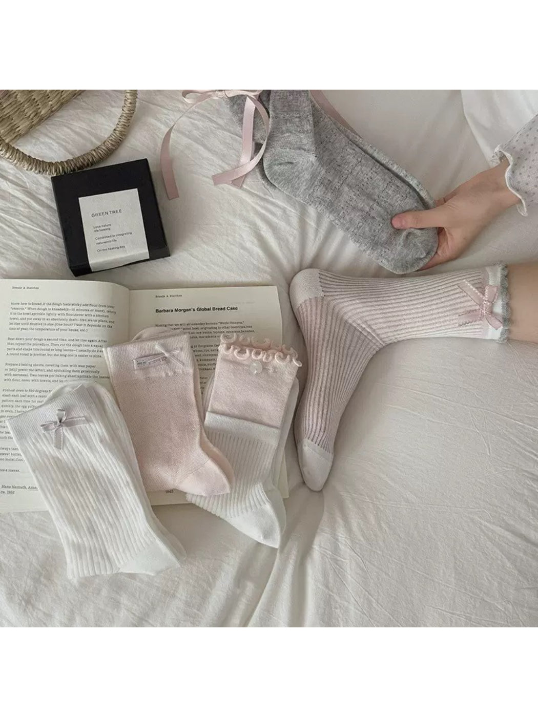 Pair of Rufia Romantic Bow Texture crew socks displayed flat showing bow and texture
