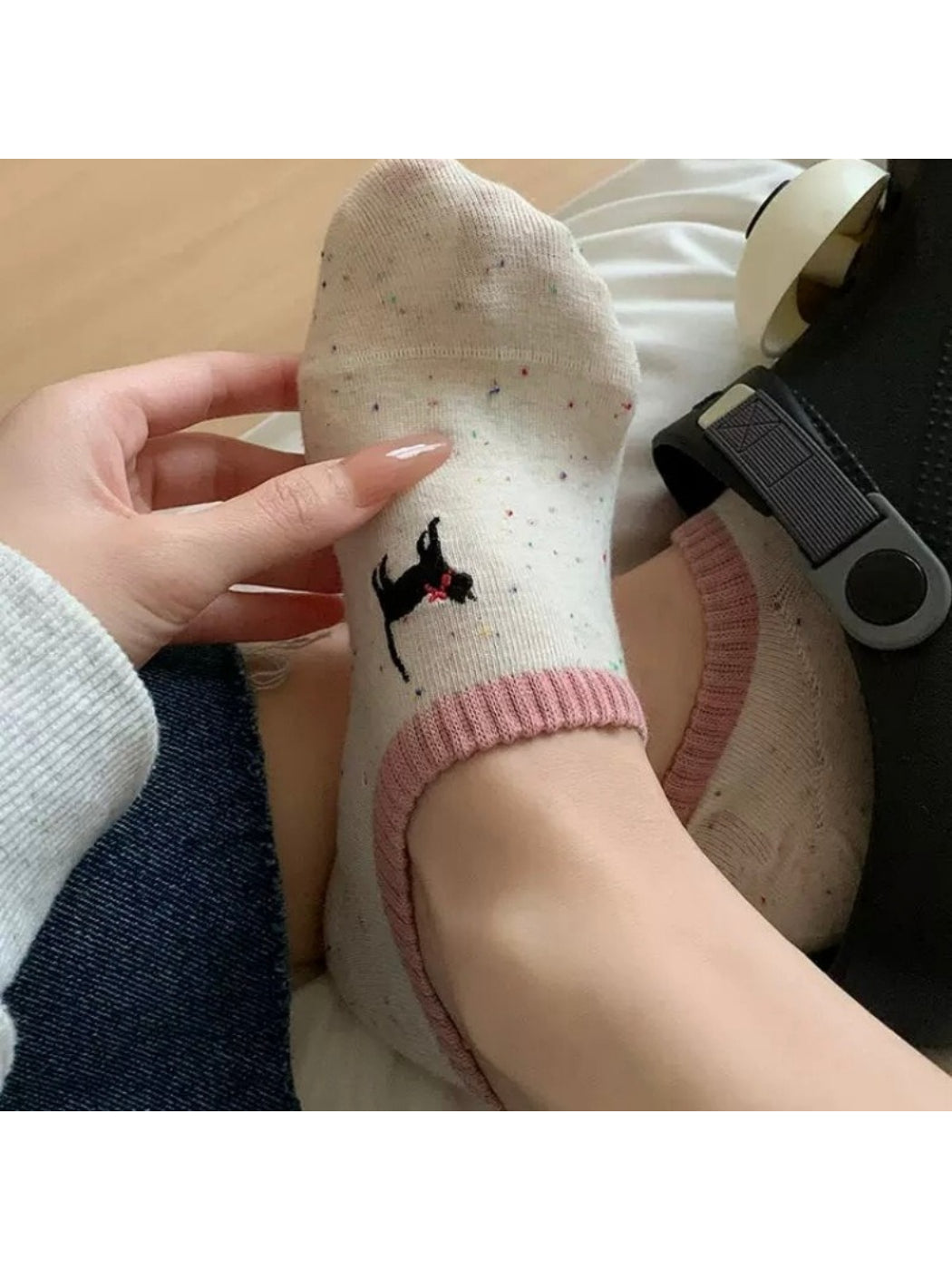 Side view of Rufia embroidered dot no show socks in neutral tone