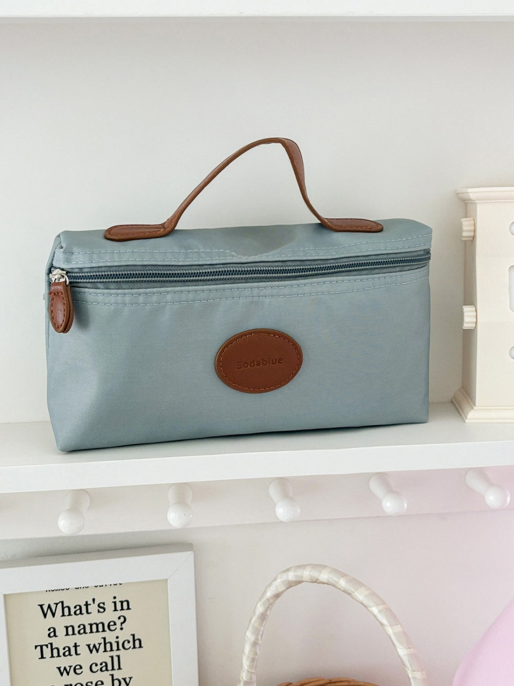 Side view of Cosbai travel pouch highlighting slim profile