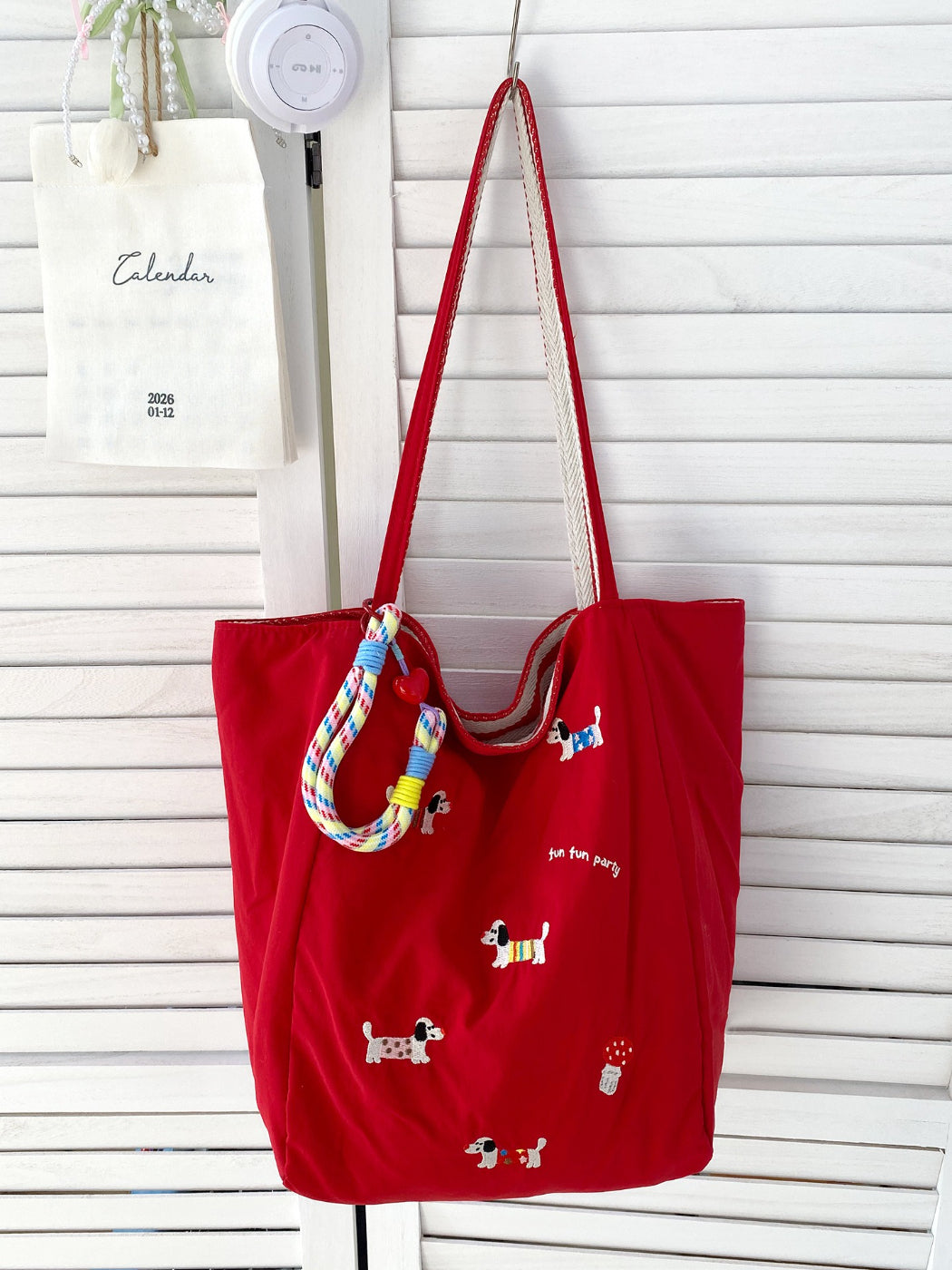 Cosbai tote bag folded flat, highlighting lightweight fabric and puppy pattern