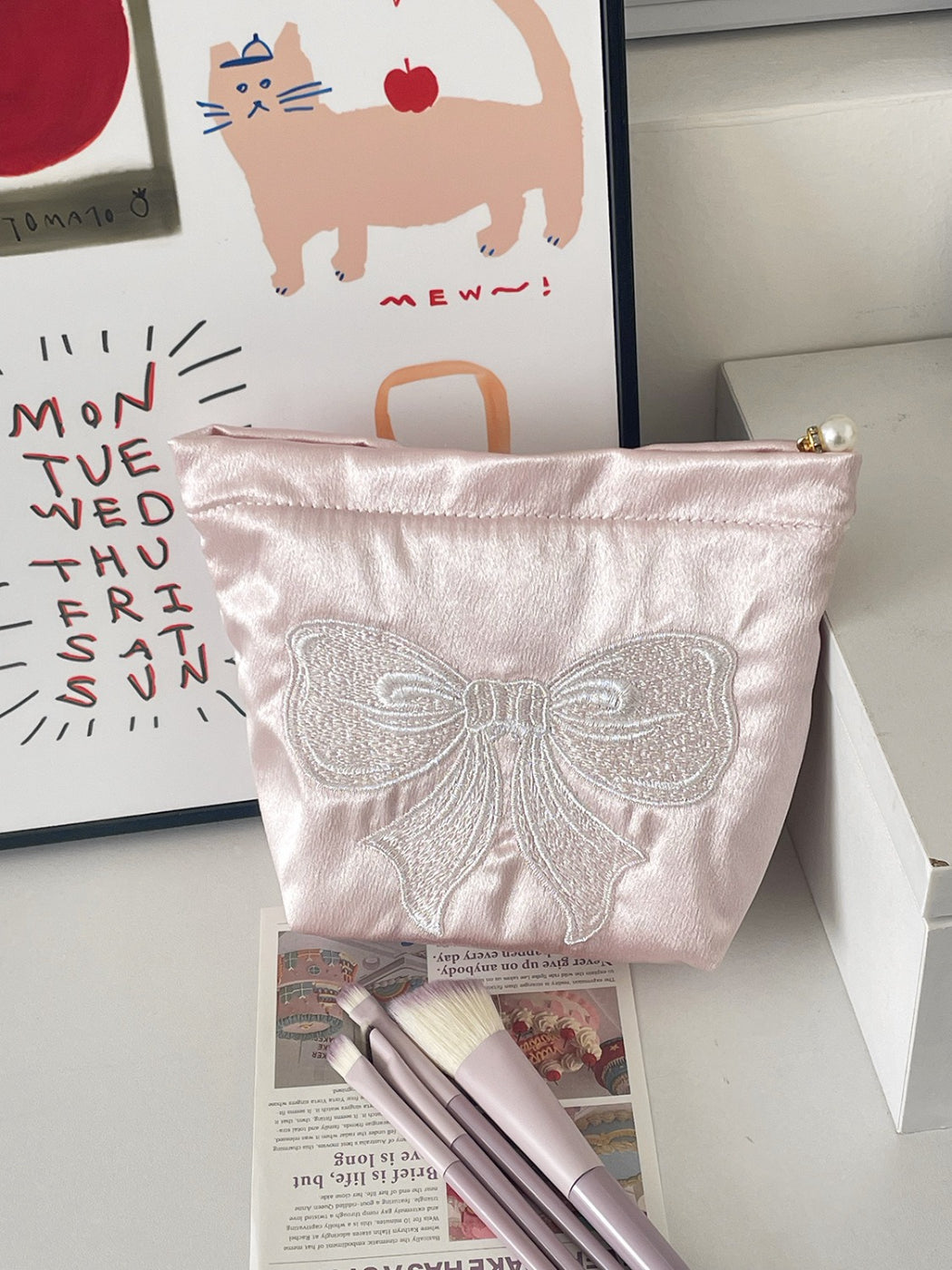 Cosbai cosmetic pouch placed on a vanity table with beauty products