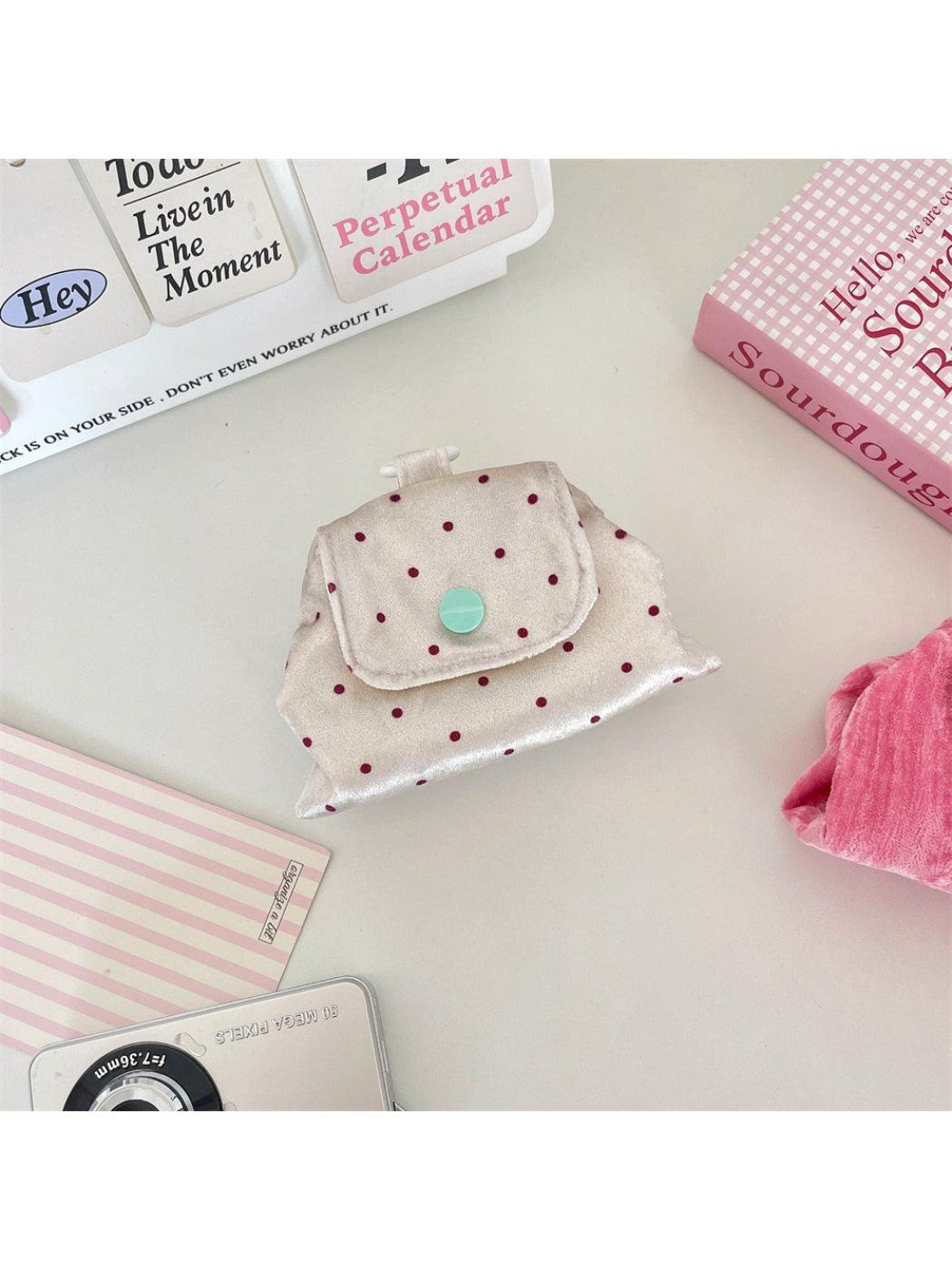Close-up of dotted texture on pink Cosbai Soft Dot Button Coin Purse