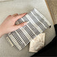 Cosbai makeup pouch with gingham bow detail in black and white