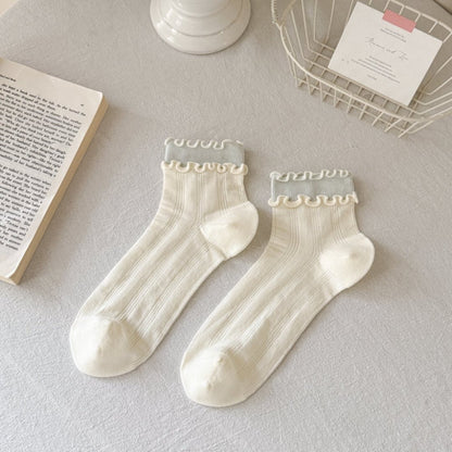 Close-up of pastel pink Rufia Sweet Ruffle Edge Crew Socks highlighting ruffle detail