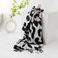 Scarvii - Black Cow Print Tassel Scarf