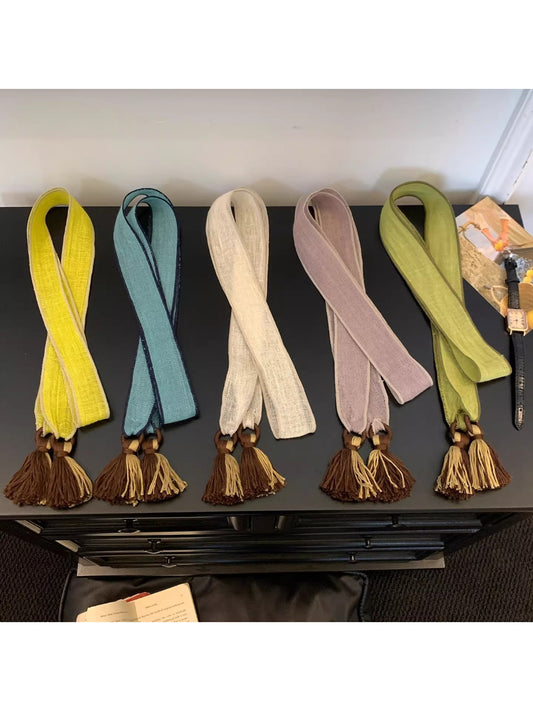 Scarvii woven tassel tie scarf displayed flat showing texture and tassel ends