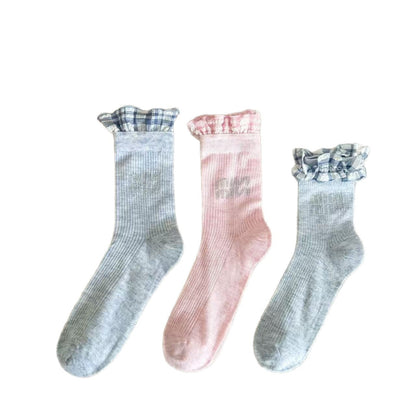Close-up of Rufia pastel mid-calf socks highlighting delicate ruffle detail