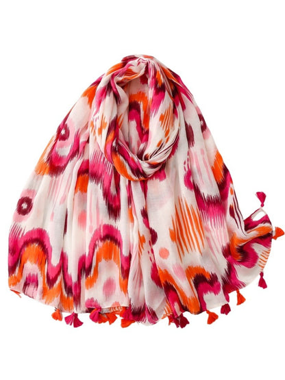 Close-up of Scarvii Boho Ikat Tassel Wrap fabric texture and detailed ikat design
