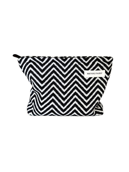 Cosbai Zigzag Print Zip Pouch with black and white zigzag pattern on a flat surface