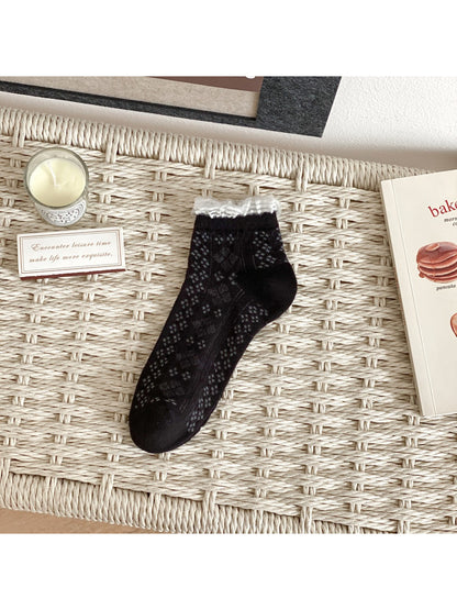Detail of the toe and heel area of Rufia fine pointelle everyday socks in beige