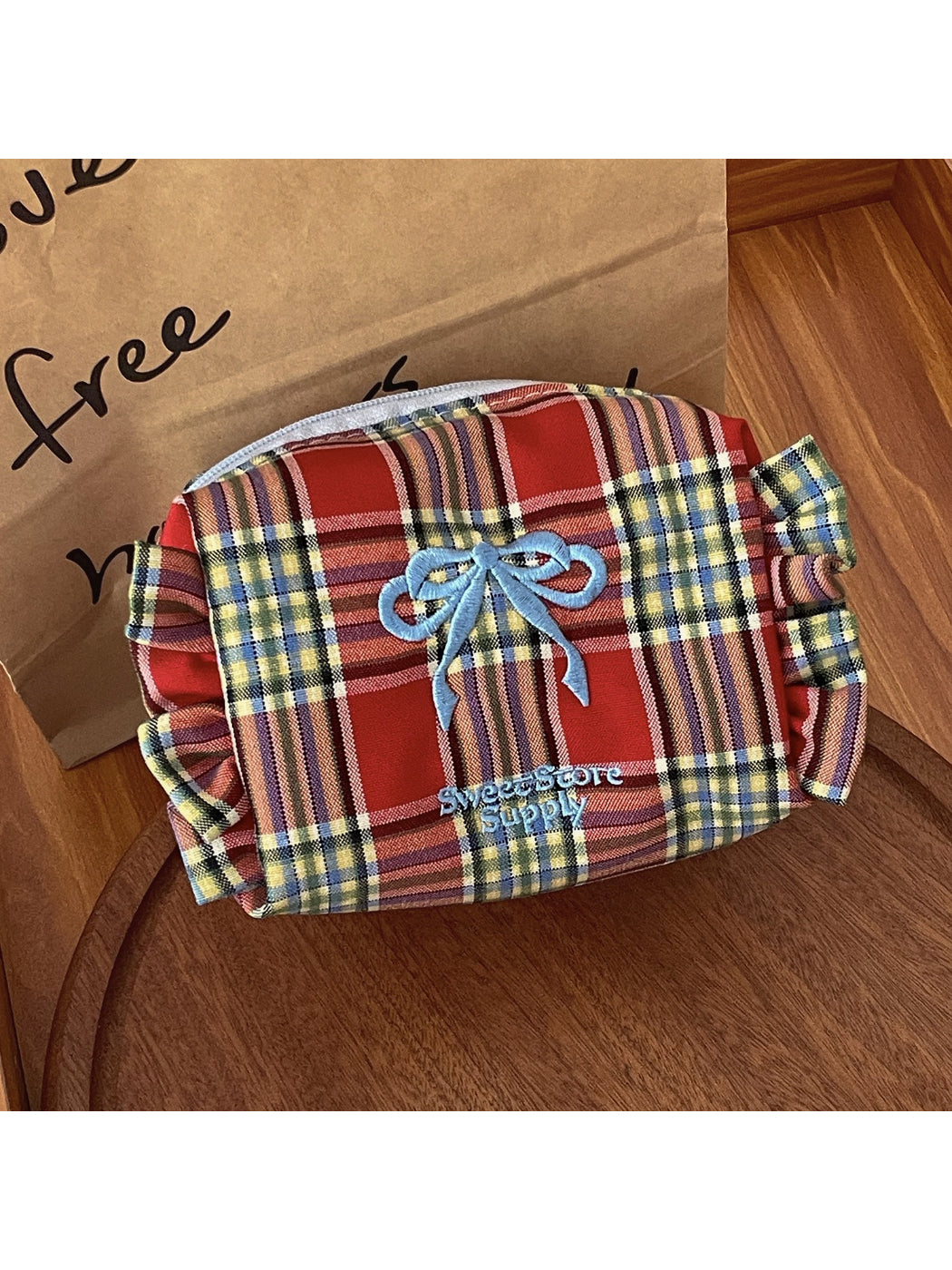 Cosbai Sweet Check Makeup Bag displayed on a white surface with soft lighting