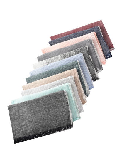 Scarvii Lightweight Farmhouse Scarf folded on a wooden surface with natural light