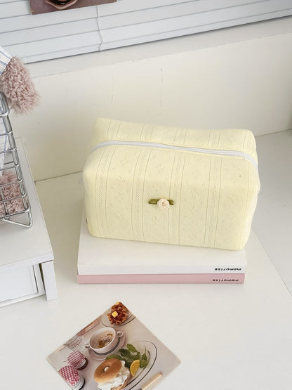 Side view of Cosbai soft textured cosmetic pouch with rose embroidery