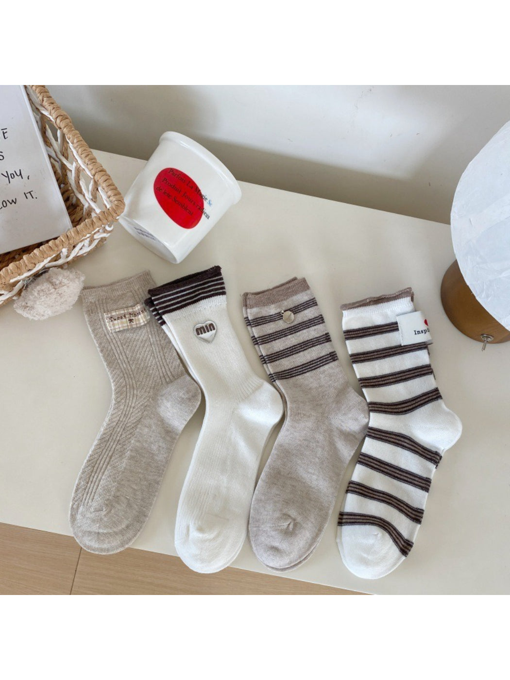 Close-up of the ribbed cuff and knit texture of Rufia neutral crew socks