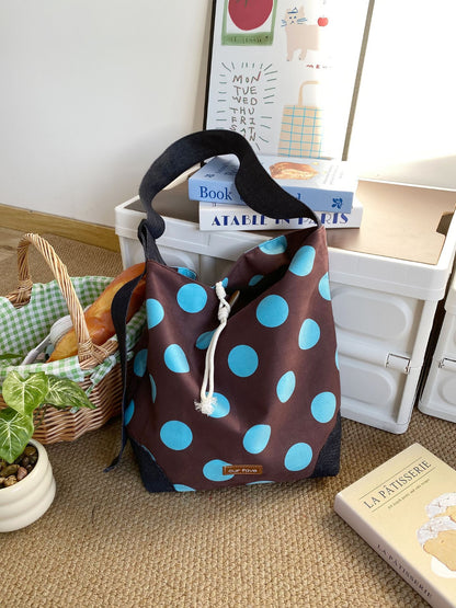 Cosbai polka dot crossbody bag open showing interior lining and spacious