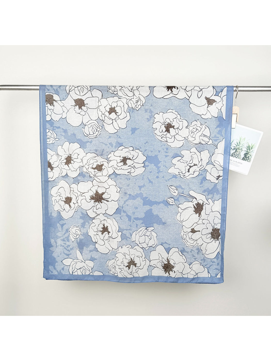 Close-up of Scarvii Statement Flower Wrap Scarf fabric texture and detailed flower print