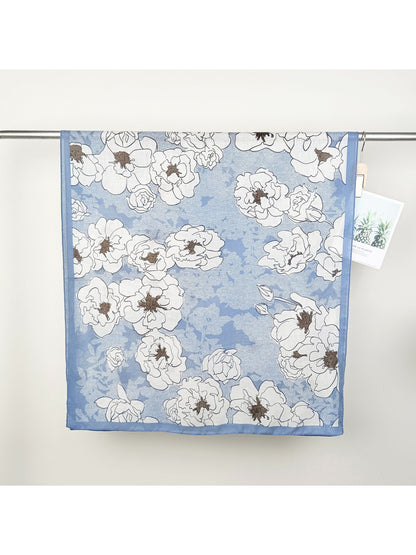 Close-up of Scarvii Statement Flower Wrap Scarf fabric texture and detailed flower print