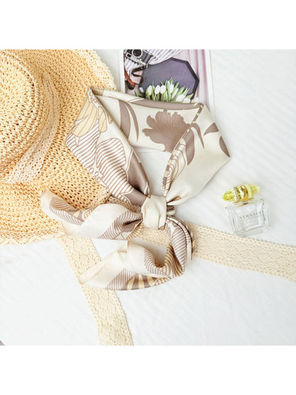 Scarf folded to display colorful flower graphics and clean edges