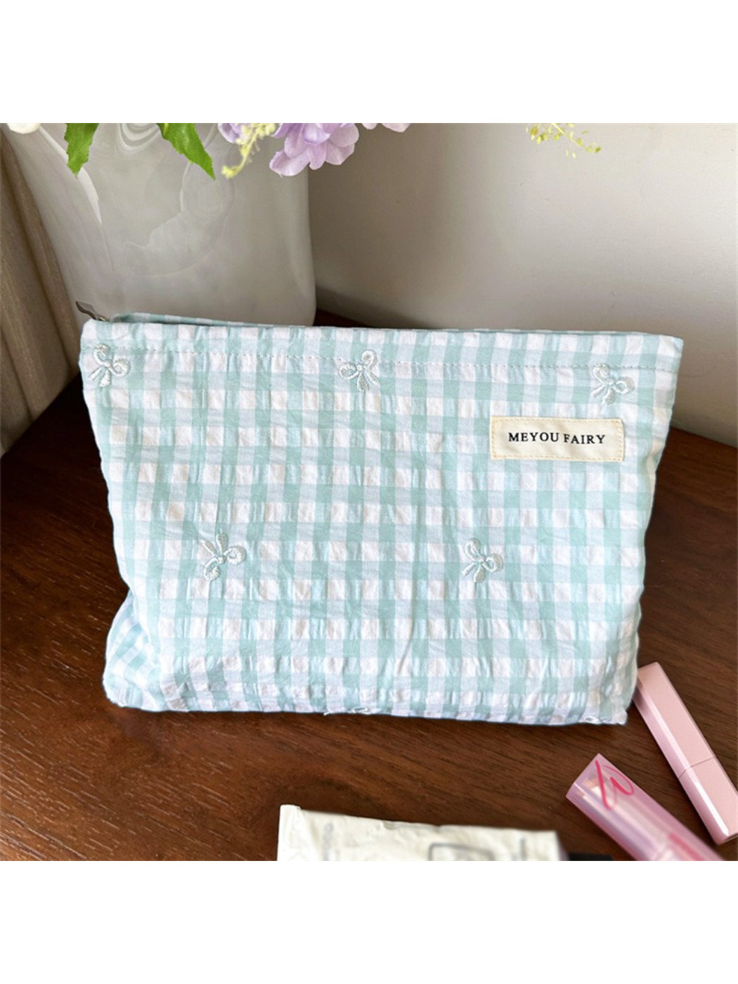 Side view of Cosbai pastel check zip pouch highlighting slim profile