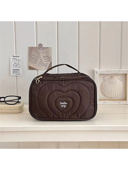 Folded Cosbai large capacity cosmetic organizer showing compact design for travel