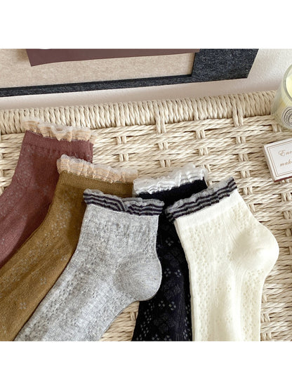 Folded Rufia fine pointelle everyday socks showing soft fabric and knit design