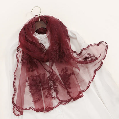 Scarvii sheer scarf with intricate embroidery laid out to show full design