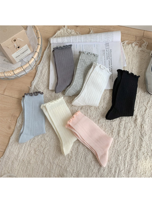 Pair of Rufia soft crew socks with delicate frill trim in light pastel color