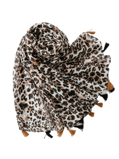 Close-up of leopard print pattern and fringed ends on scarf