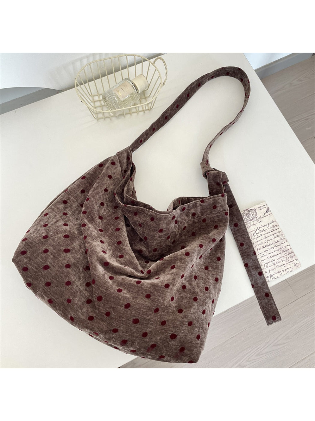 Top view of Cosbai Polka Dot Crossbody Slouchy Bag highlighting slouchy design