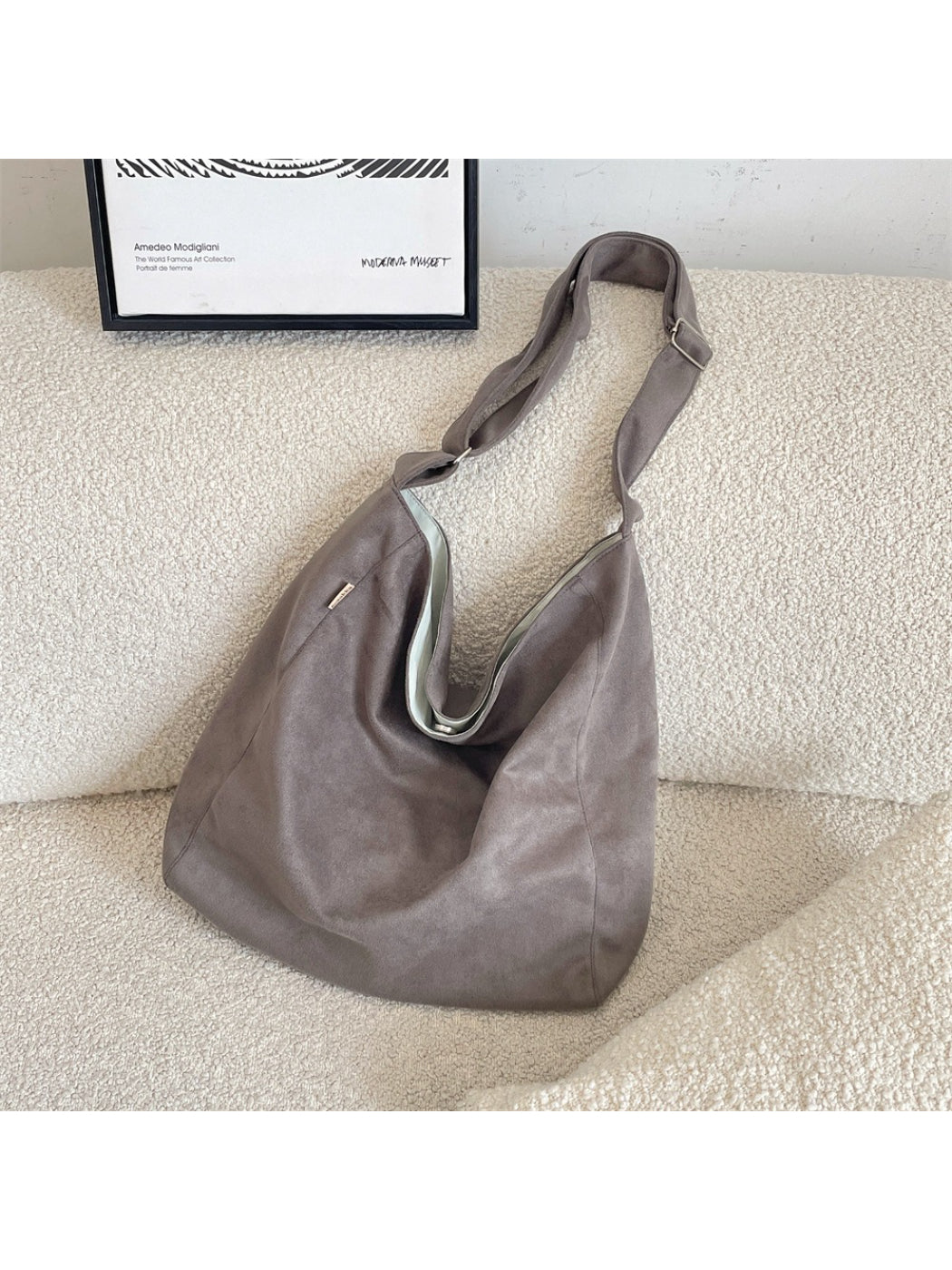 Cosbai soft slouchy minimal shoulder tote bag worn on shoulder, styled with casual outfit