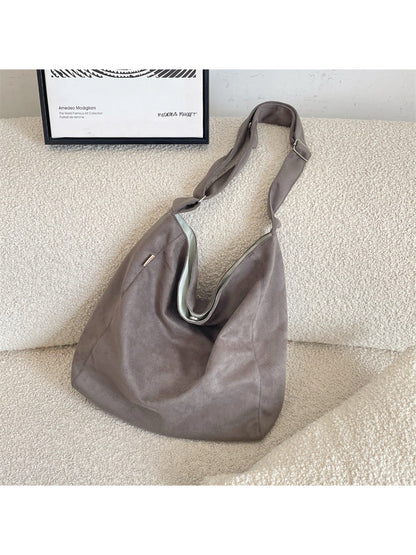 Cosbai soft slouchy minimal shoulder tote bag worn on shoulder, styled with casual outfit