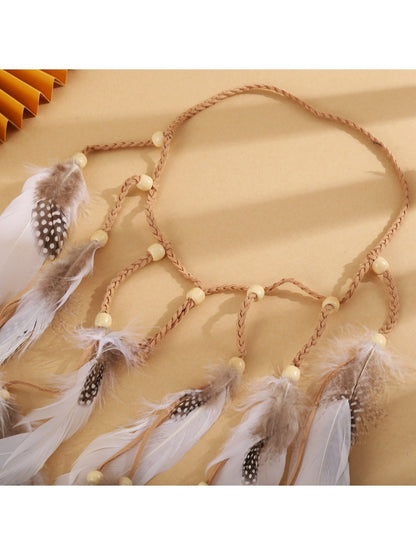 Hairish festival hair headband displayed flat showing feather and bead design
