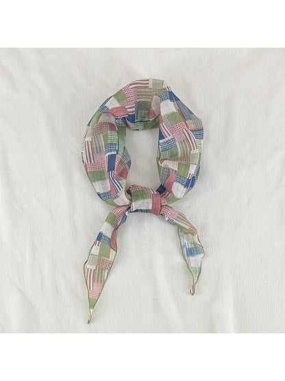 Scarvii vintage patchwork skinny scarf folded neatly on wooden surface