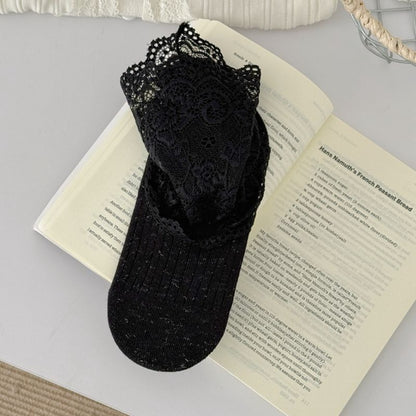 Side view of Rufia romantic lace trim crew sock showing intricate lace detail
