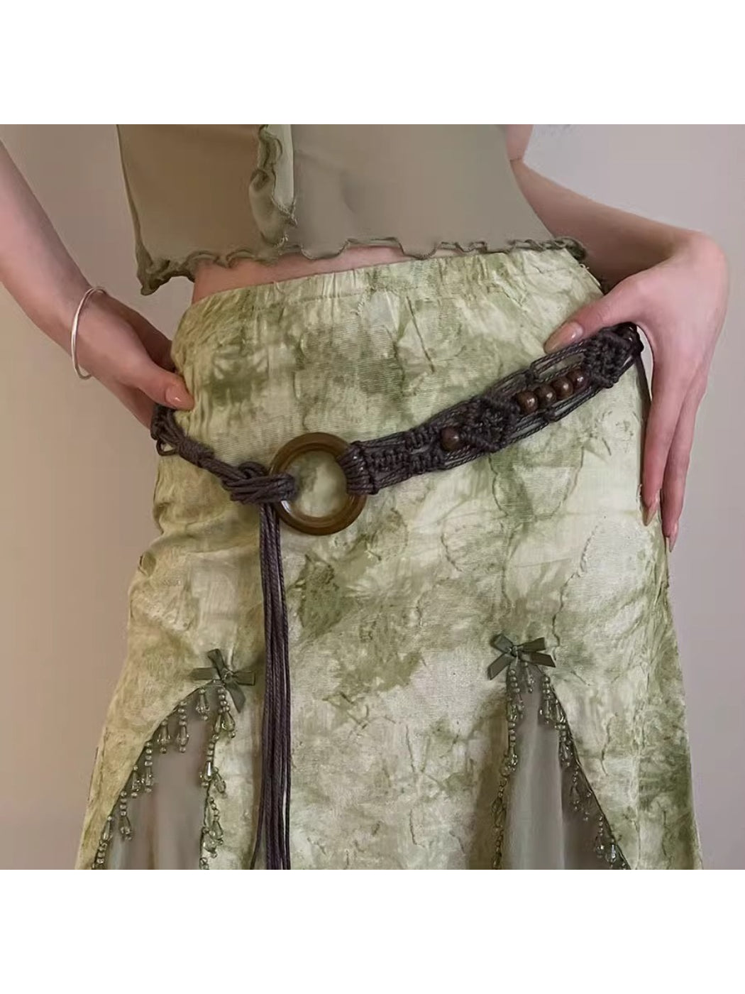 Close-up of Beco Boho braided rope waist belt with natural fibers and wooden bead detail