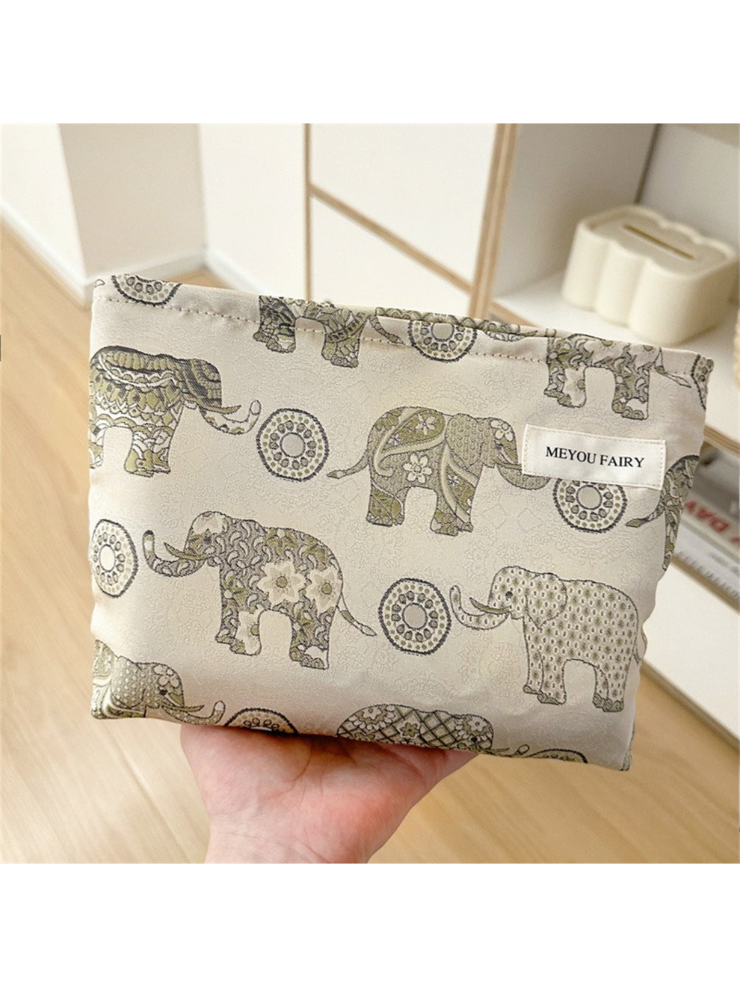 Close-up of elephant pattern and detail on Cosbai cosmetic bag