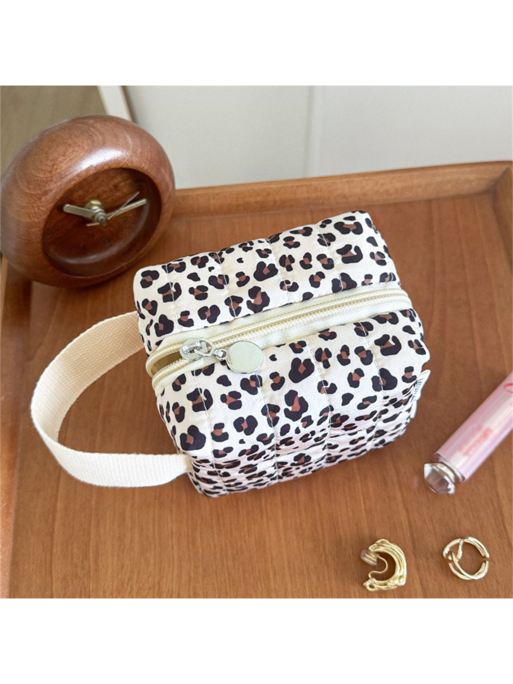 Cosbai soft handle cosmetic bag placed on a flat surface with handle extended
