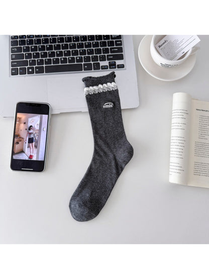 Top view of Rufia contrast braid knit socks displaying the braided knit design and color contrast