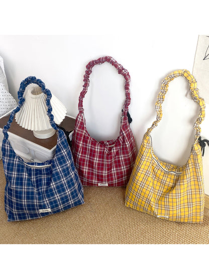 Side view of Cosbai plaid slouchy shoulder bag showing soft fabric texture