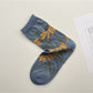 Rufia floral blue crew socks with botanical pattern