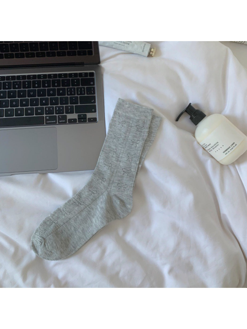 Rufia Ribbon Stripe Sheer Socks folded to highlight sheer fabric and stripes