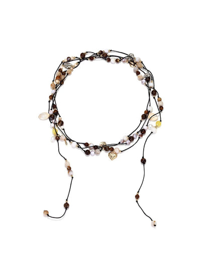 Neckit multi strand cord necklace displayed flat showing beaded detail on each strand