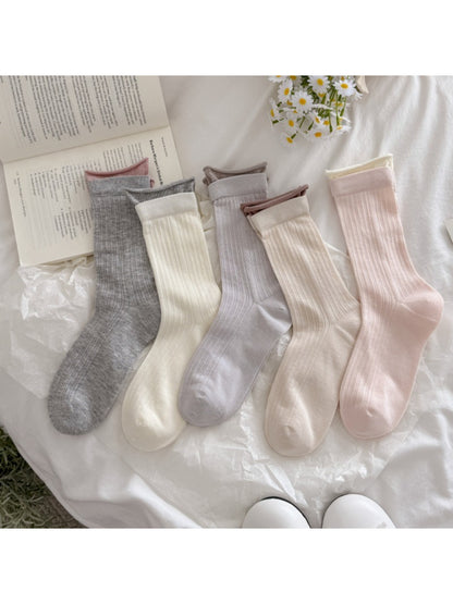Close-up of Rufia solid rib texture socks in beige color