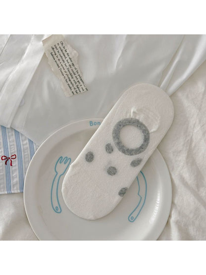 Multiple pairs of Rufia invisible socks with various puppy designs arranged in a row