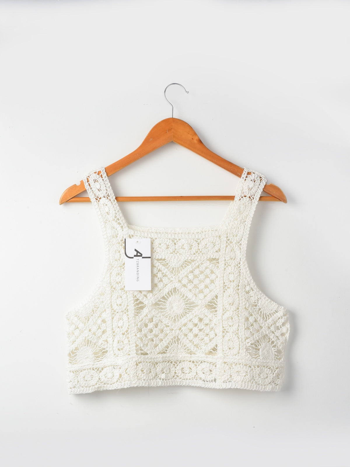 Model wearing Crosa vintage crochet camisole tank top styled with jeans