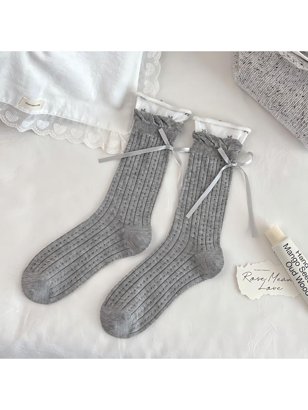 Close-up of white Rufia Romantic Lace Cuff Crew Socks lace cuff and fabric texture
