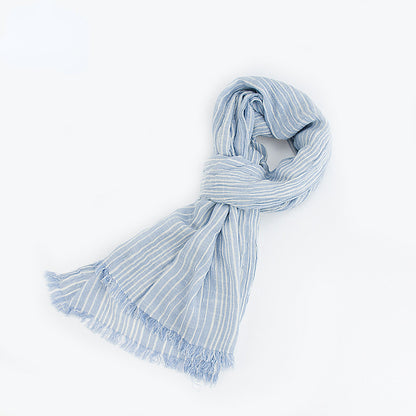 Scarvii scarf displayed on wooden surface showing striped pattern